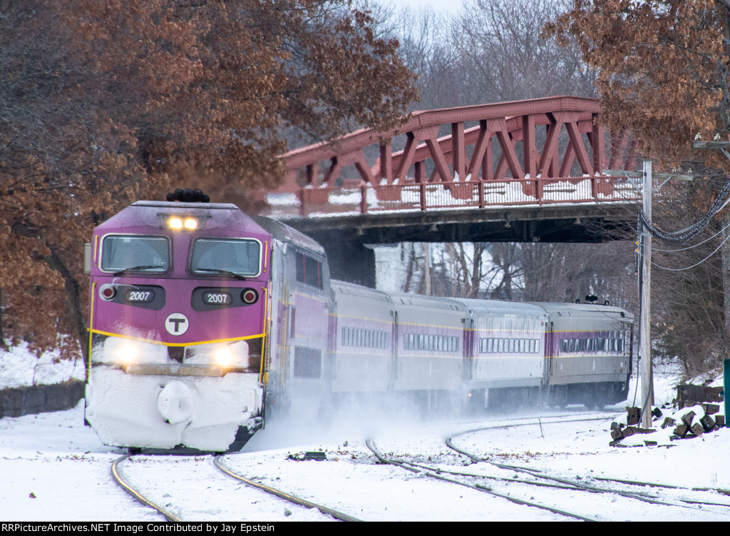 An outbound rounds the bend under Main Street